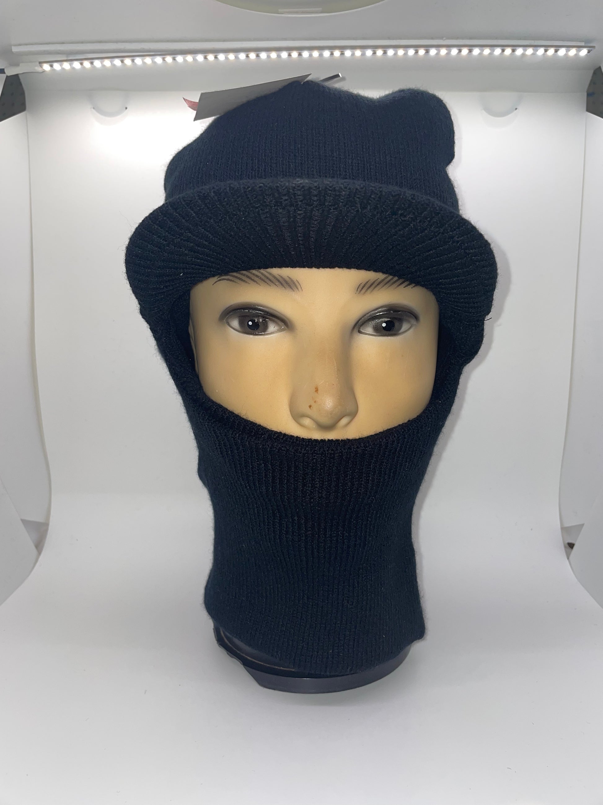"Navy blue ski mask with a quilted texture and a reinforced heel and toe"