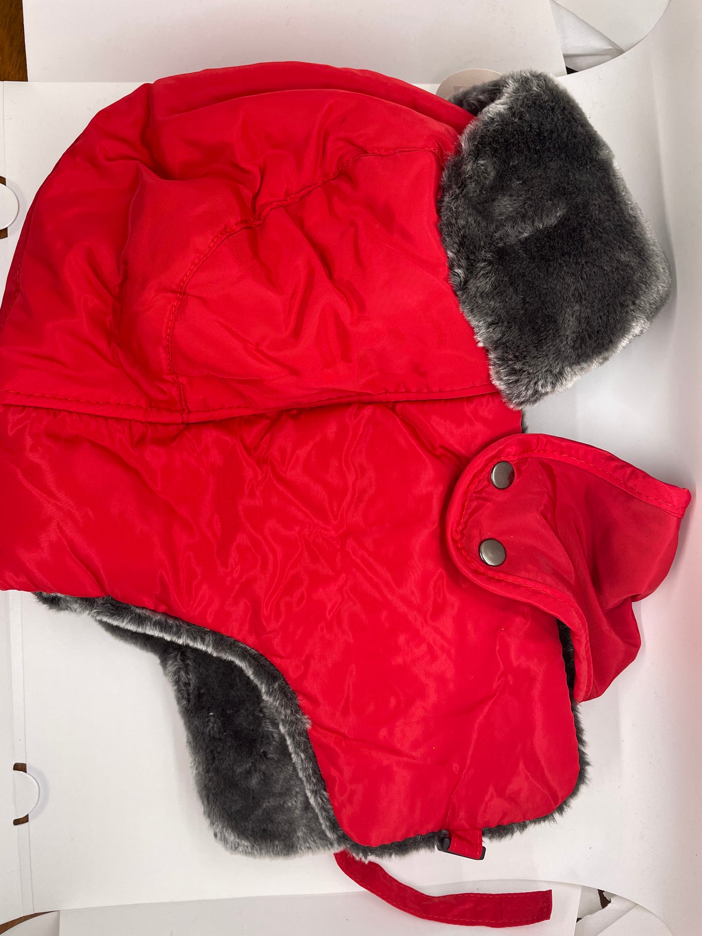 "Red ushanka hat with mask and a padded headband"