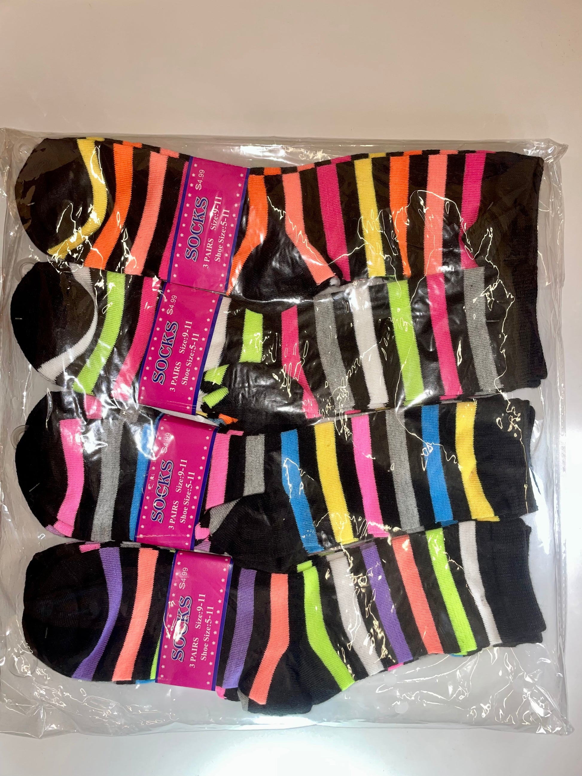 "Women's crew socks with a striped pattern and a moisture-wicking design"