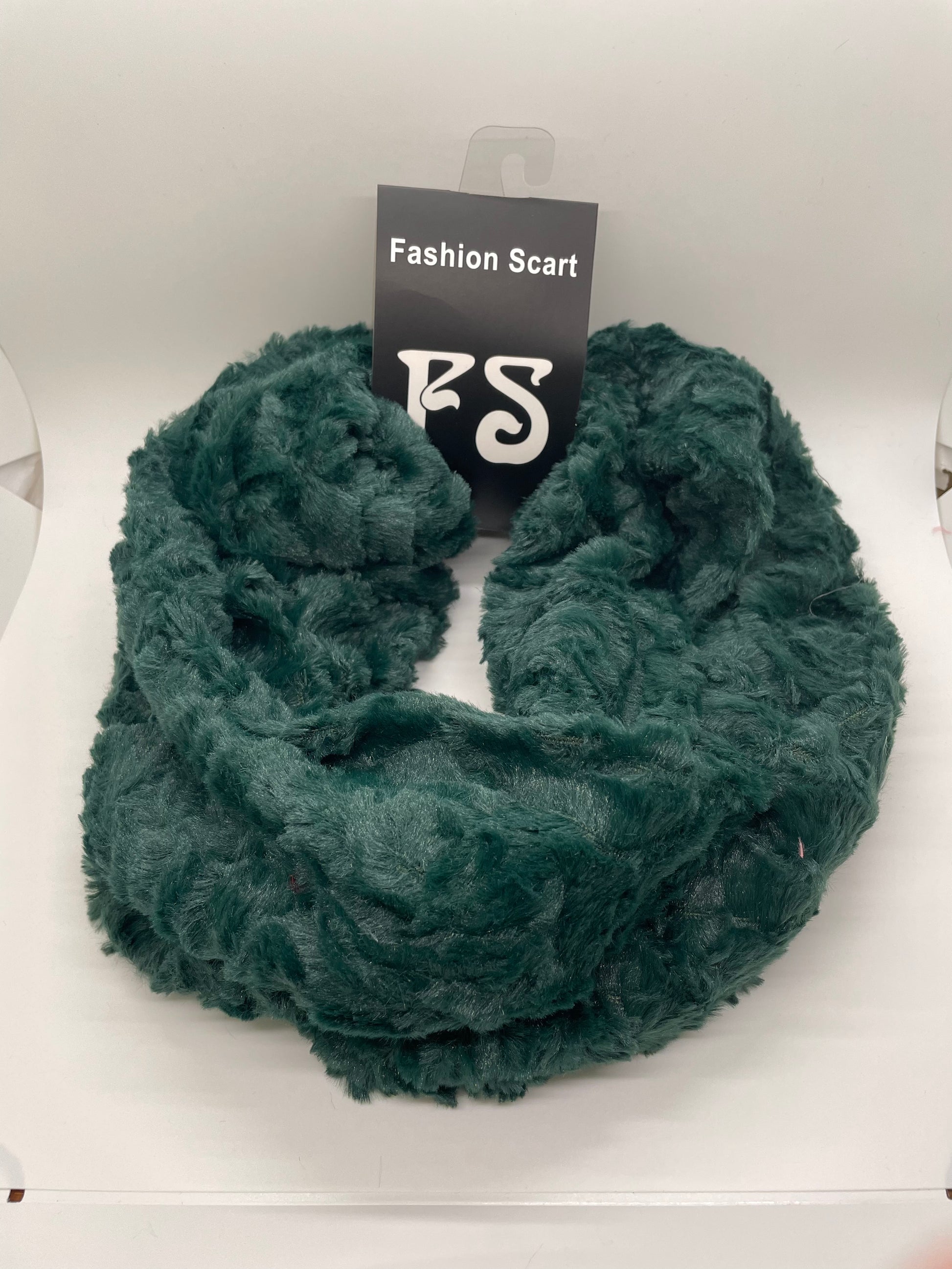 "Black infinity scarf with a knit flower detail and a fold-over cuff"
