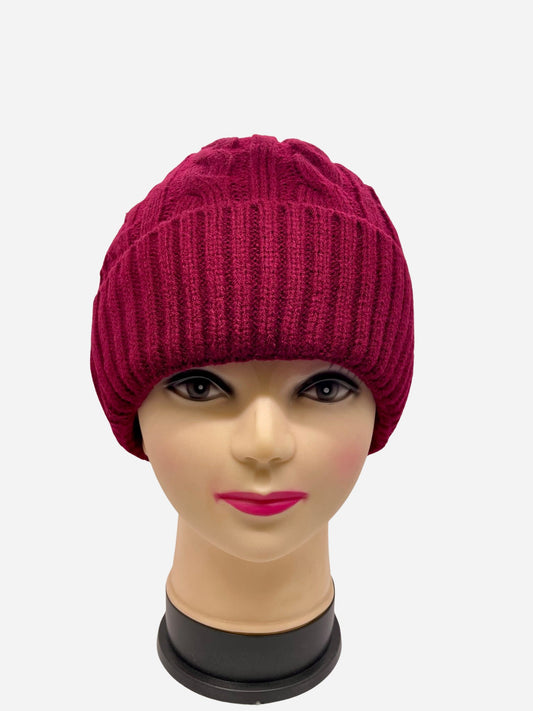 "Red knitted beanie with a cable knit pattern and a fringed edge"